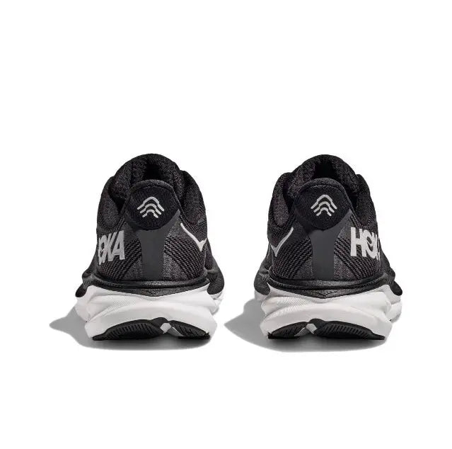 Black HOKA running shoes, heel view with padded collar and white midsole