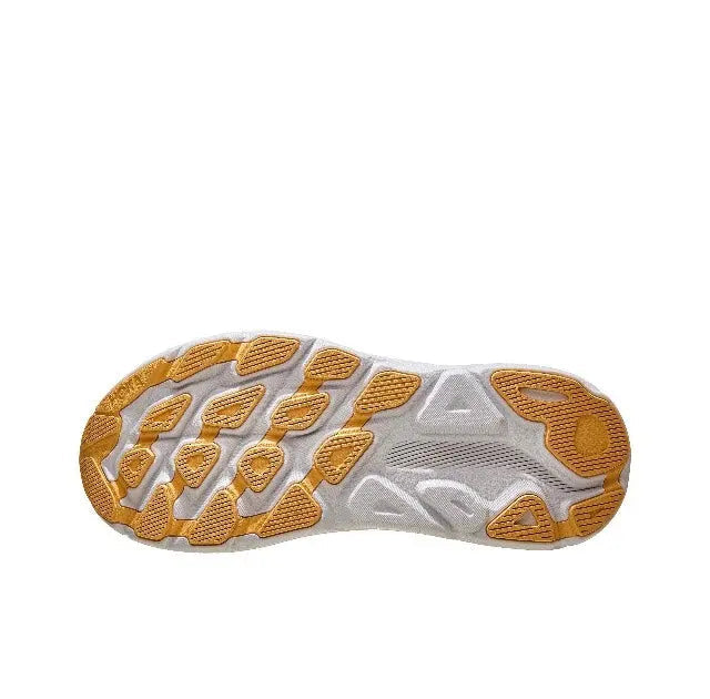 Hoka wide running shoe outsole with orange and gray tread, blue side stripe