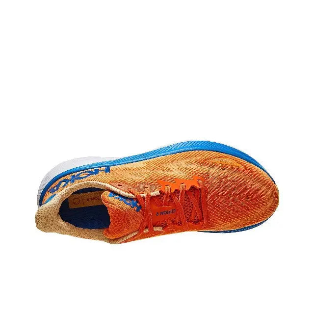Hoka orange running shoe side view with blue collar trim and patterned upper