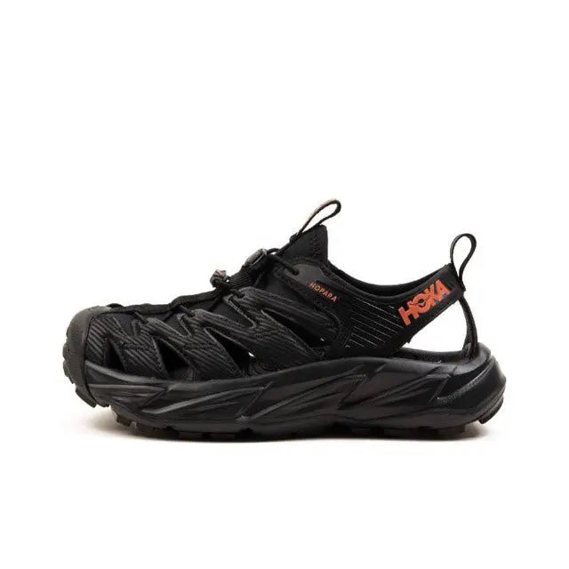 Hoka Hopara black trail shoe with orange logo accents, lace-up design