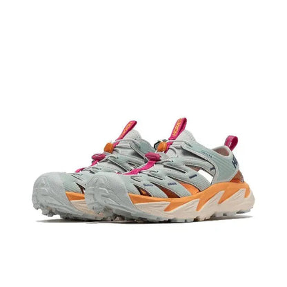 Hoka Hopara athletic shoe with light gray uppers, teal overlays, orange stripes, fuchsia laces
