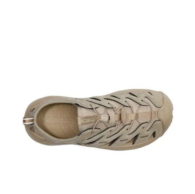 Trail sandal in light beige with open toe cutouts and textured midsole