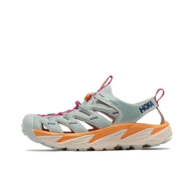 Hoka Hopara athletic shoe front view in light gray with teal stripes, orange midfoot, fuchsia laces