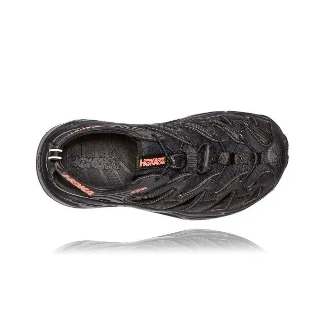 Trail shoe side view, black with patterned mesh upper and lace details