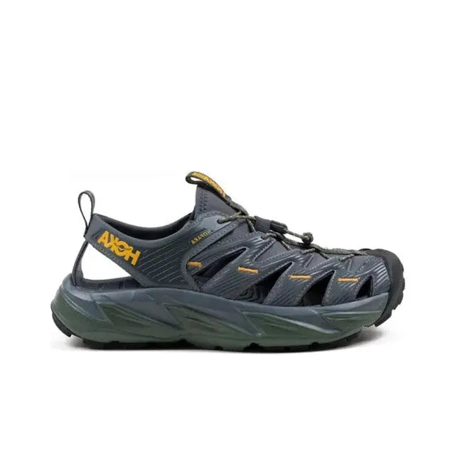Trail sandal in dark navy with yellow heel pull tab and olive-green sole
