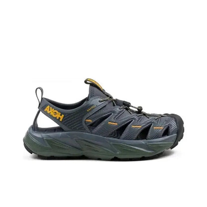 Trail sandal in dark navy with yellow heel pull tab and olive-green sole