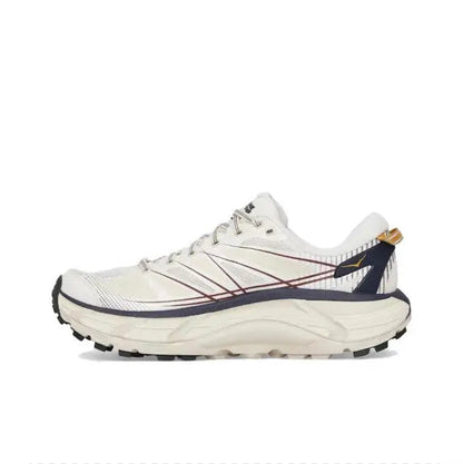 Trail running shoe in light cream with navy overlays, lace-up, rugged tread sole