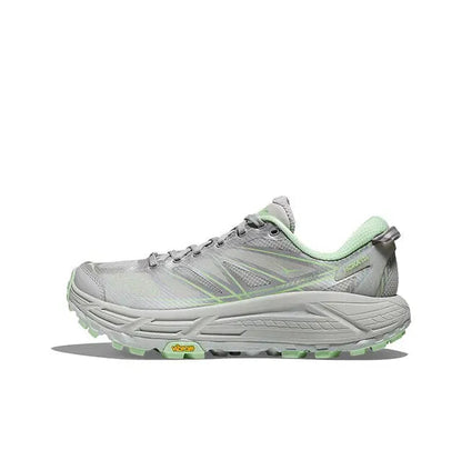 Light gray running shoe with green accents, lace-up and cushioned rubber outsole
