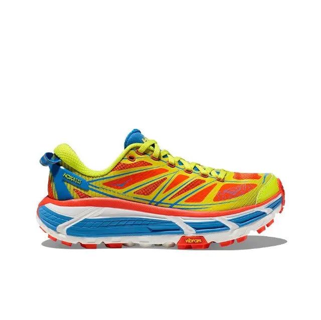 Trail running shoe with neon green upper, blue accents, and red laces