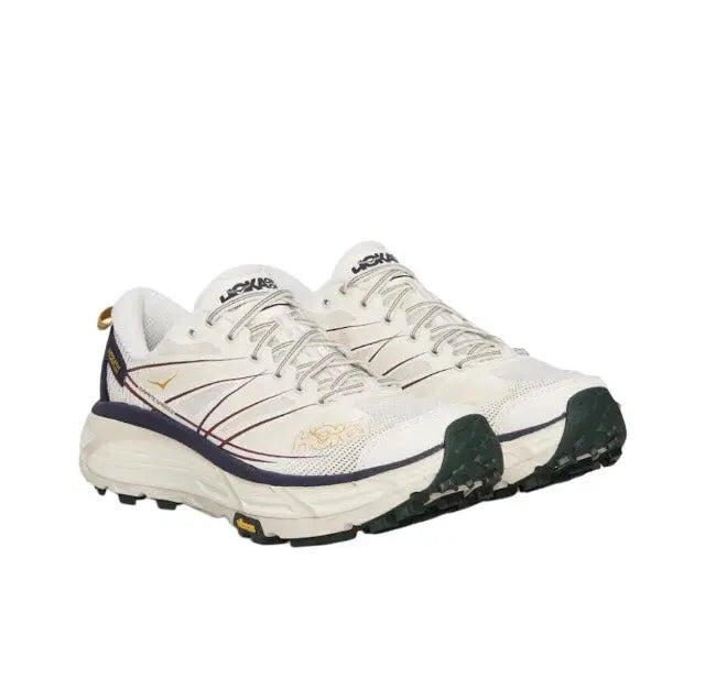 Trail running shoe, light cream mesh with navy side panel and chunky outsole