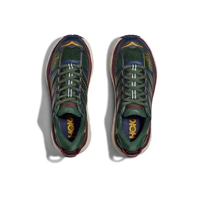 Pair of trail shoes in dark navy and green, cream midsoles and maroon heel trim