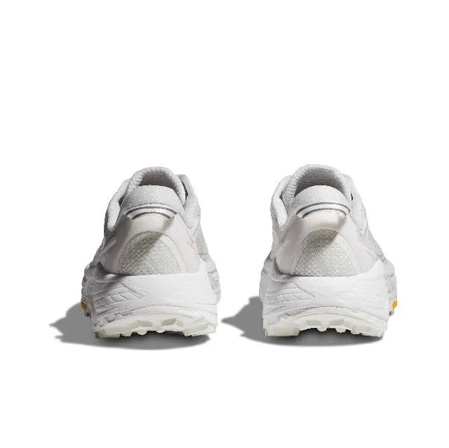 Light-colored running shoe heel view with cushioned sole and padded collar
