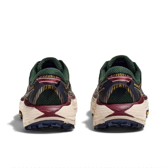 Trail running shoe with green collar, maroon heel pull, cream sole and dark tread
