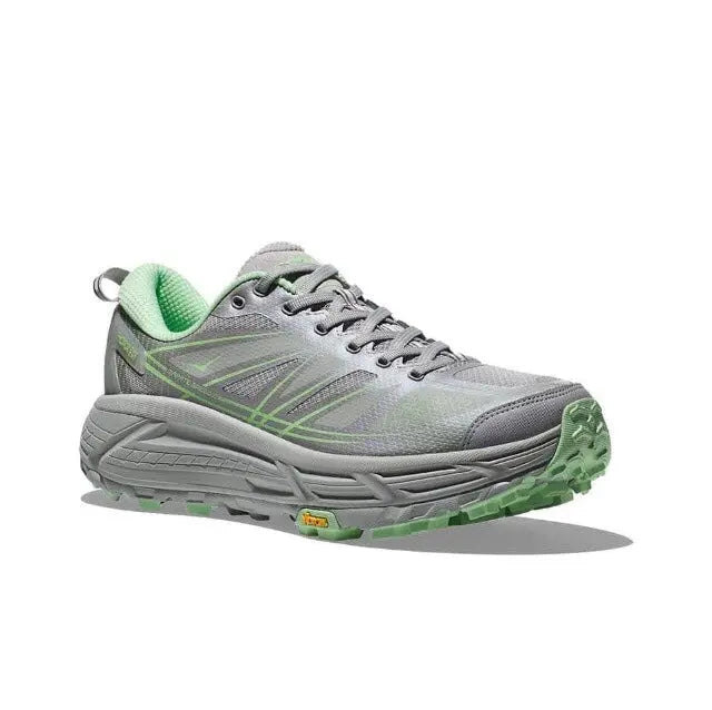 Light gray trail running shoe with green lining, lace-up front, grippy tread