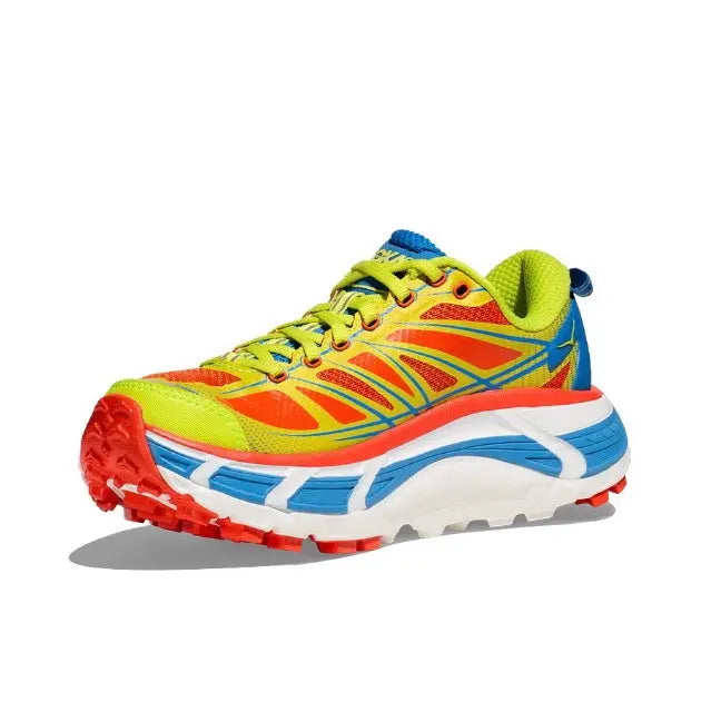 Trail running shoe side view with neon green, red, and blue mesh upper