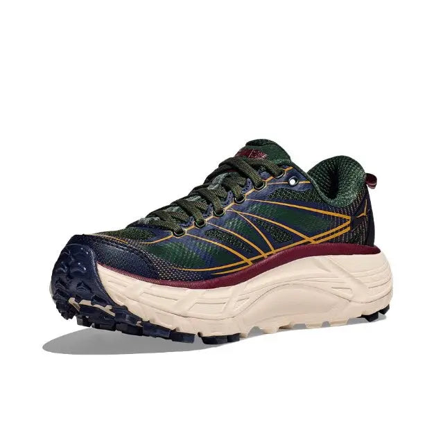 Trail running shoe in dark navy and green with yellow logo lines, maroon trim