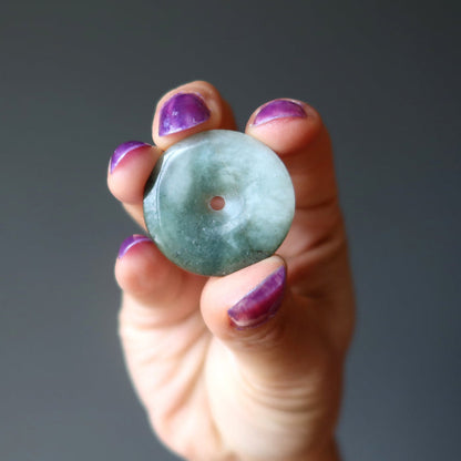 hand holding jade donut