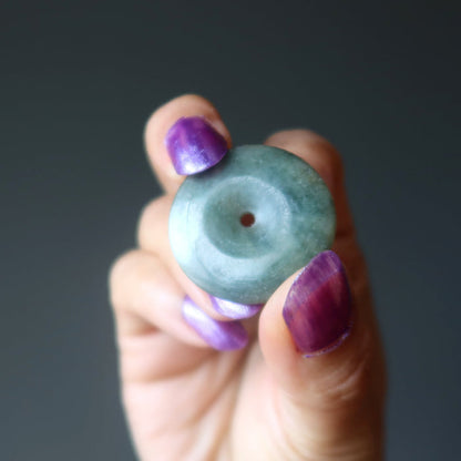hand holding jade donut