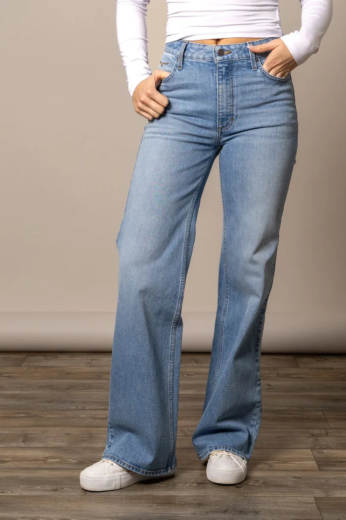 Light blue jeans with wide flared legs, button closure, and belt loops