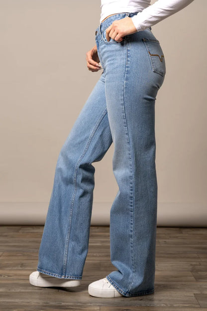Light blue bootcut jeans with stitched design on front pockets and side seam