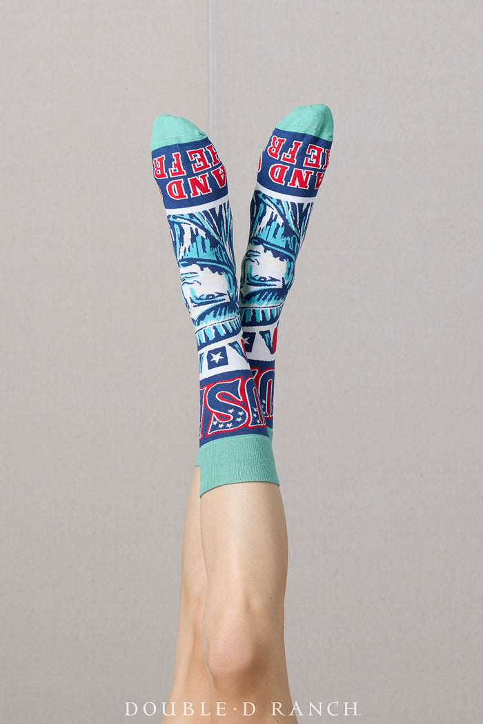 Pair of turquoise crew socks with Statue of Liberty faces and red-white-blue accents