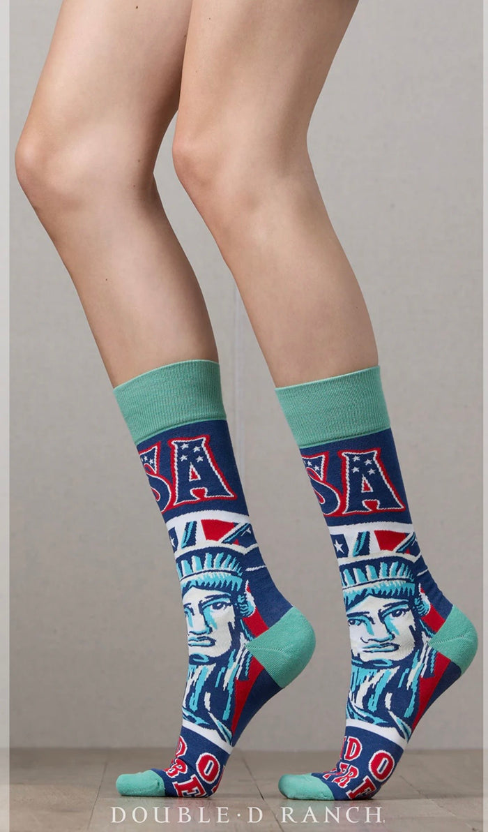 Turquoise crew socks with Statue of Liberty graphic and red-white-blue lettering