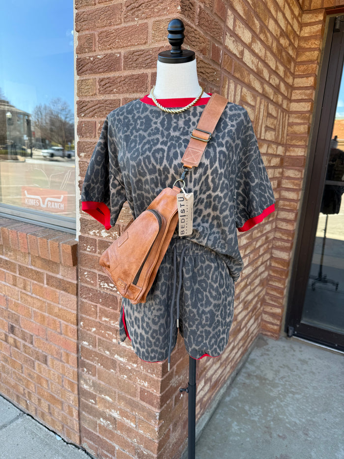 Leopard waffle knit short set on mannequin, blue-gray leopard print with red trim