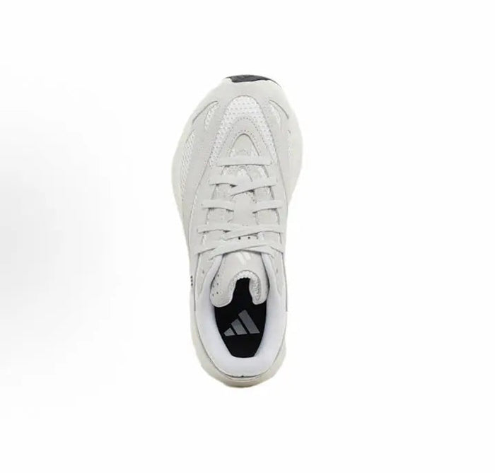White low-top running shoe with lace-up front and black logo patch at heel.