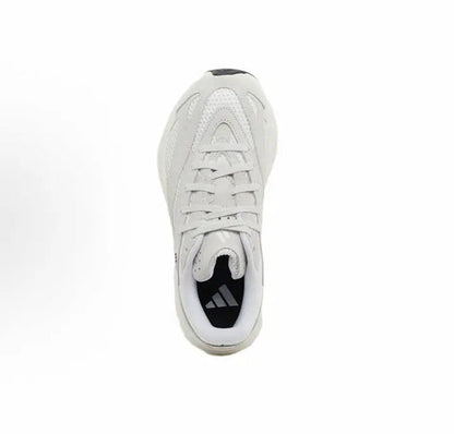 White low-top running shoe with lace-up front and black logo patch at heel.