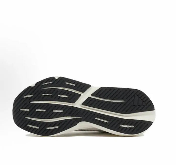 Black-and-white rubber outsole with deep tread on a low-top running shoe.