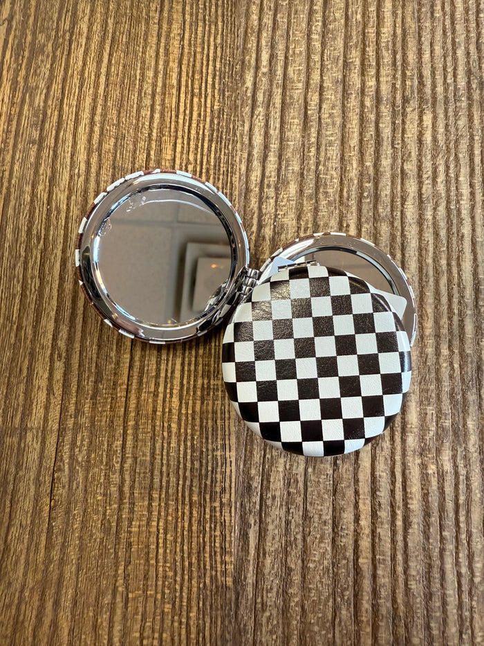 Black checker mirror compact with round mirror and hinged case, silver-tone trim