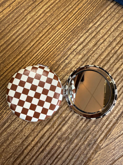 Brown checker mirror compact, round hinged case with reflective mirror
