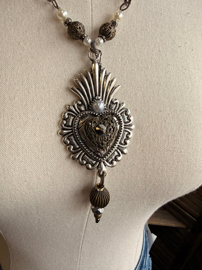 Heart pendant necklace, ornate black heart with rays and dangling bead charm