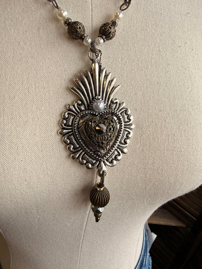 Heart pendant necklace, ornate black heart with rays and dangling bead charm
