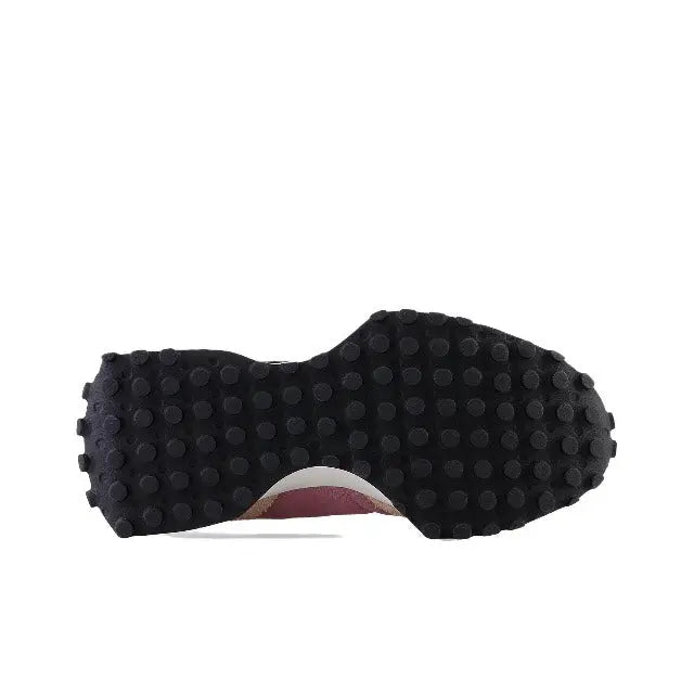 Sneaker outsole with dark tread and light heel insert