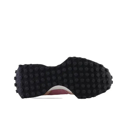 Sneaker outsole with dark tread and light heel insert