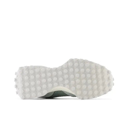 New Balance MS327 sneaker outsole with textured tread, grey and white.