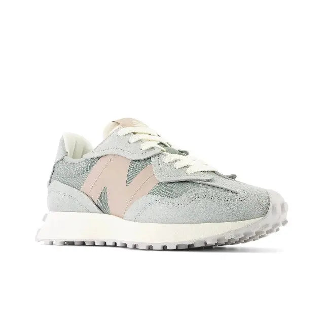 Low-top sneaker side view in light gray with teal logo accents and beige heel