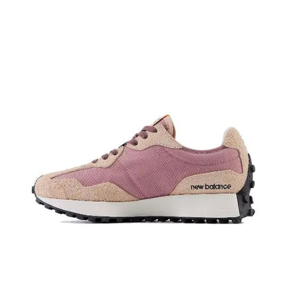 Sneaker side profile in rose water and tan with 'new balance' logo and laces