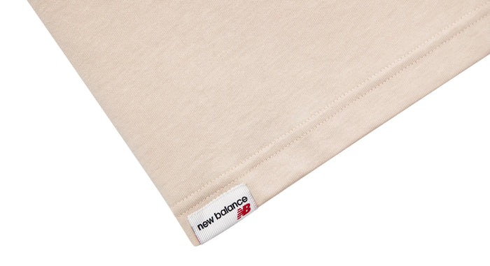 Cream T-shirt hem with 'new balance' tag