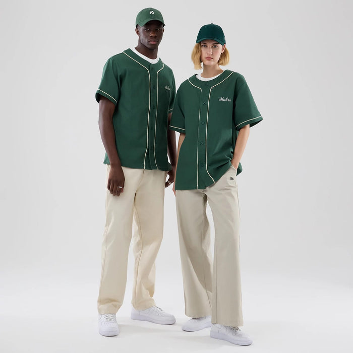 The model is wearing this New Era Baseball Jersey in dark green. 1