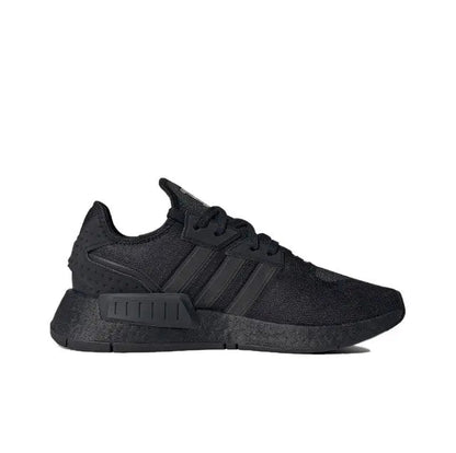 Low-top sneakers side view, dark black fabric and rubber cupsole