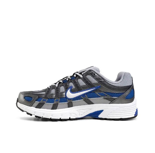 Running sneaker in gray with blue accents and white midsole