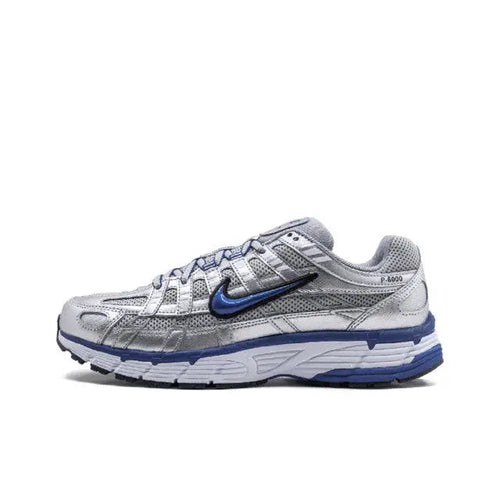 Nike running shoe in silver and blue, mesh/synthetic upper, lace-up with Swoosh.