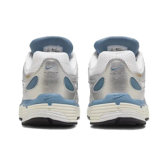 White and blue sneakers, rear view with Nike heel branding