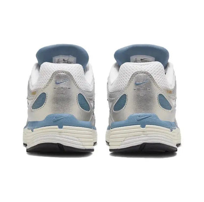White and blue sneakers, rear view with Nike heel branding