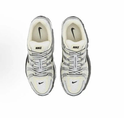 Nike P-6000 premium sneakers, light gray and cream with black swoosh, top view