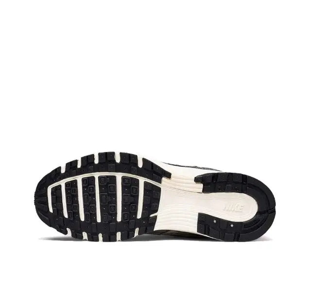 Nike P-6000 Premium sneakers, outsole tread side view in silver and black