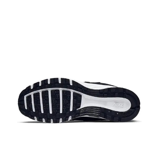 Nike P-6000 Premium sneaker outsole view, dark tread and white midsole
