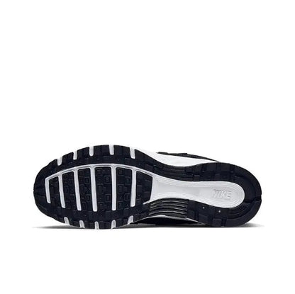 Nike P-6000 Premium sneaker outsole view, dark tread and white midsole